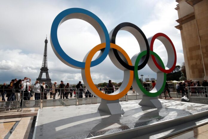 Olympic rings to celebrate the IOC official announcement that Paris won the 2024 Olympic bid are seen in front of the Eiffel Tower at the Trocadero square in Paris