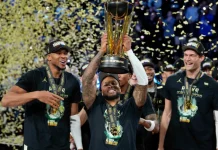 Damian Lillard firmó un contrato de por vida con Adidas Damian Lillard levanta el trofeo de campeón de la NBA Cup.